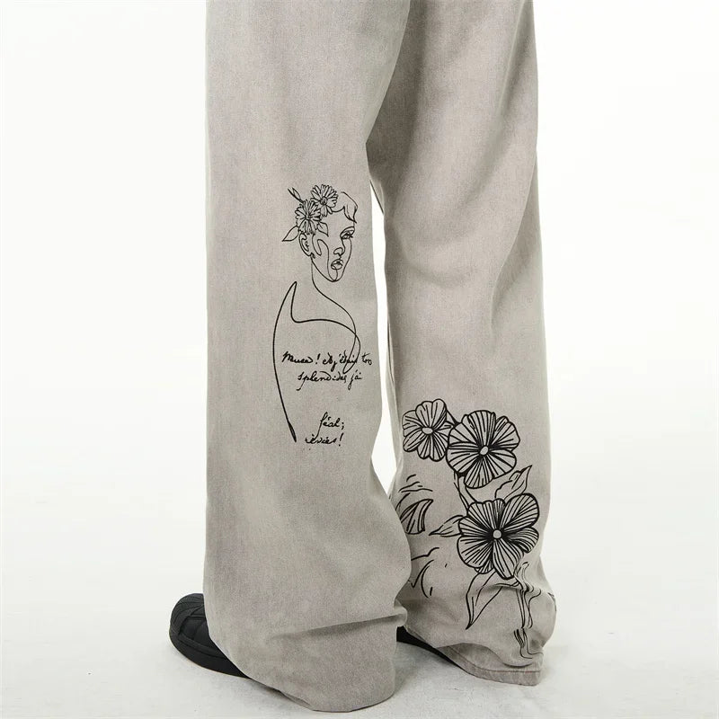 جينز مطبوع عليه رسومات جرافيتي أمريكية عتيقة